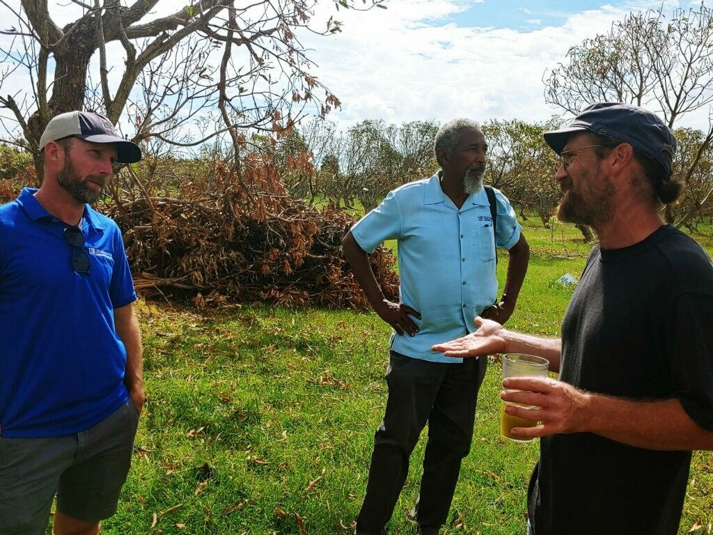 Pine Island – (Left to right), David Outerbridge, director of UF/IFAS Extension Lee County; Stephen Brown, horticulture agent for UF/IFAS Extension Lee County, and Lee Keener of Gatherings Grove farm on Pine Island, talk about damage to Keener’s farm after Ian.